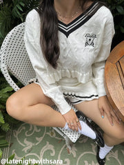 Knit V-neck Badge Graphic Ruffle Trim Contrasting Binding Long Sleeve Crop Top