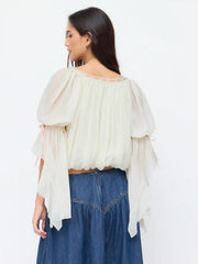 Blusa con volantes, cuello redondo y lazo fruncido en gasa texturizada