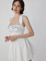 Vestido Mini de Algodão com Estampa Floral, Decote Halter, Manga Curta, Bordado e Laço